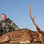 Man with his 32" Axis Buck kill