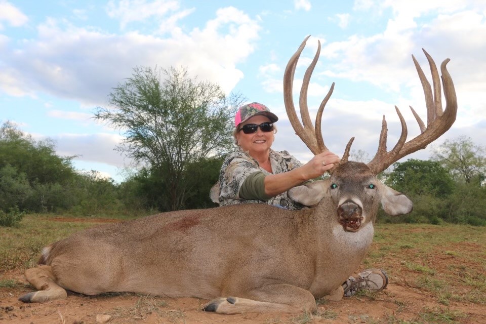 Cheryl Schmidt with a large 207" Whitetail Buick